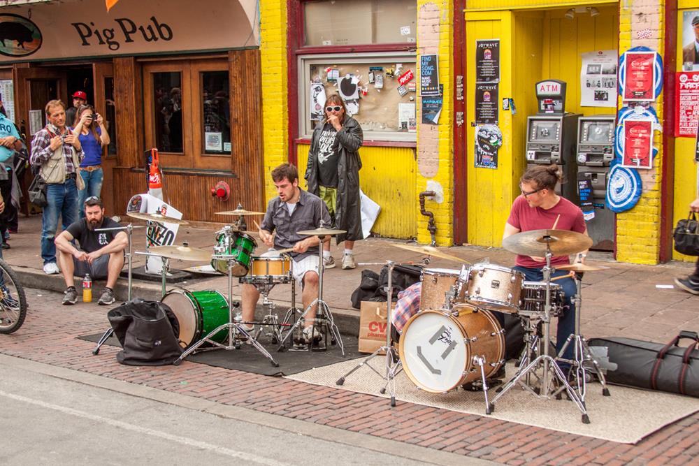 SXSW festival musicians having an impromptu jam session on Sixth St