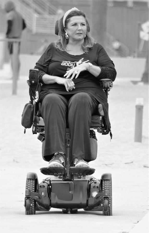 Why is Abby Miller in a wheelchair? image 2